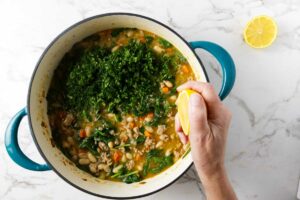 Tossing in herbs and a squeeze of fresh lemon juice into the bean soup.