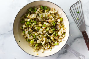 Sauteeing the vegetables for the fennel stuffing.
