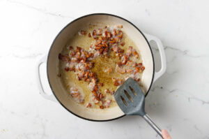 Cooking bacon in a skillet.