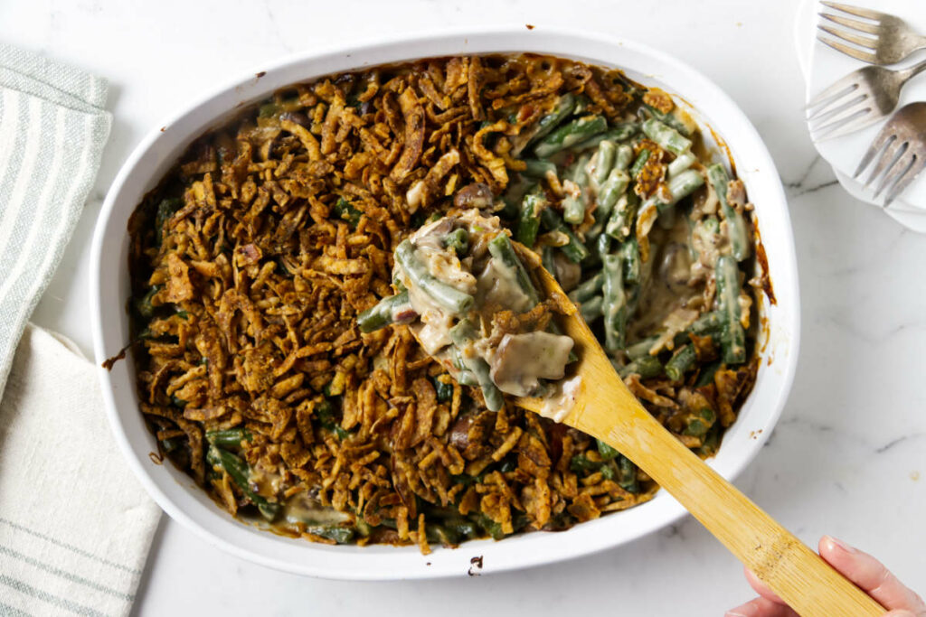A green bean casserole from scratch in a white casserole dish.