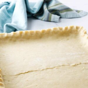 Pie dough shaped into a sheet pan.