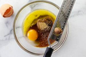 Mixing sugar and eggs for the pecan pie cookies.