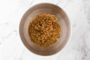 Mixing the brown butter with the sugar.