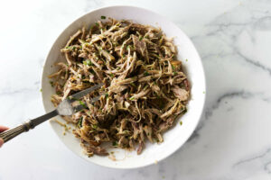 Marinated pulled pork for the cuban sandwich ingredients.