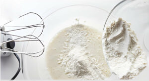 Blending the flour mixture into the batter.