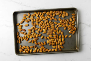 Toasting almonds on a sheet pan.