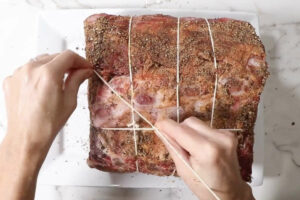 Tying the prime rib with butchers twine.