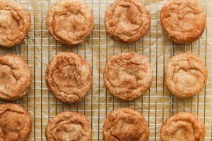 Cooling snickerdoodle cookies on a rack.