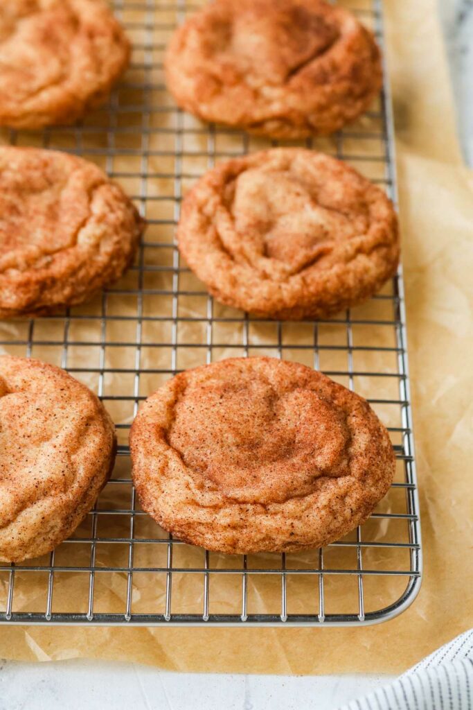 Several cookies on a baking rack.