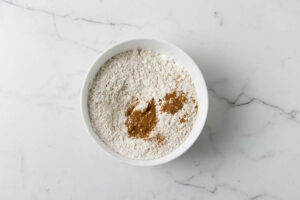 Sifting the dry ingredients in a bowl.