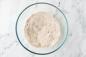 Sifting the dry ingredients in a bowl.