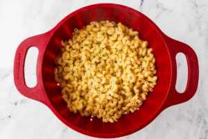 Draining cooked pasta in a colander.