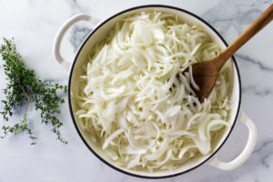 Sliced onions in a large skillet.