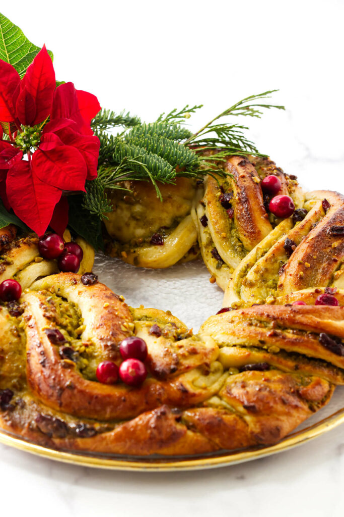 A babka wreath filled with pistachio paste and cranberries.