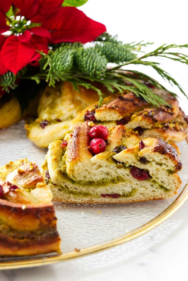 A pistachio babka shaped into a wreath on a serving platter.