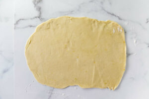 Rolling the dough into a rectangle.
