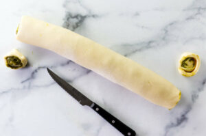 Slicing the ends off the log of babka dough.