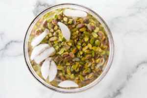 Cooling the nuts in a bowl of ice water.