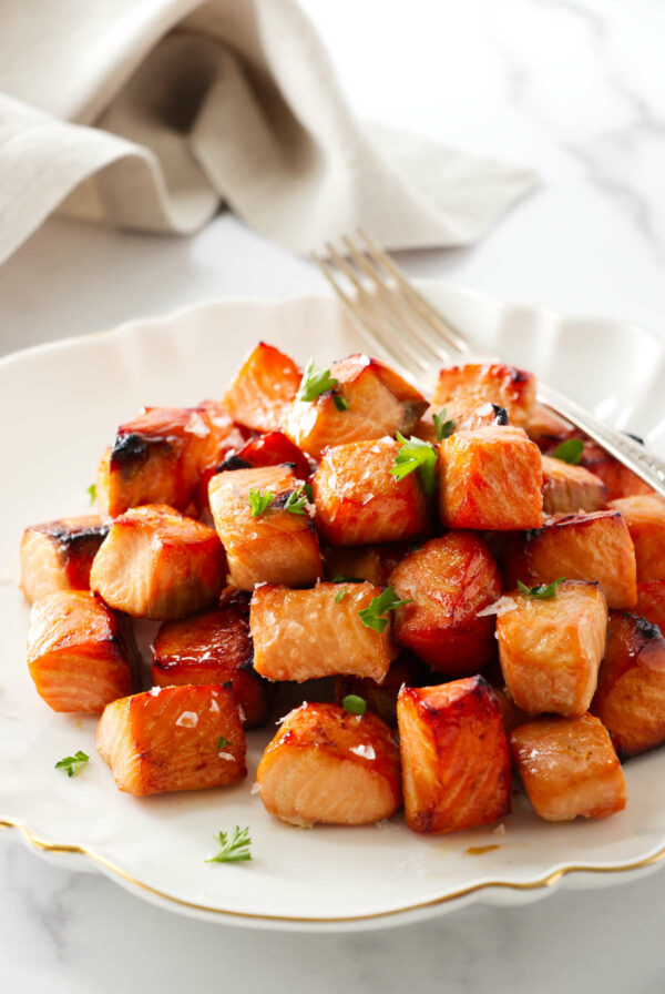 Chunks of salmon bites on a plate.