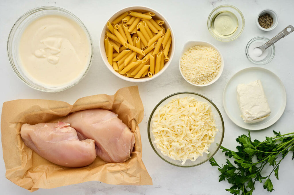 Ingredients used to make alfredo pasta bake.