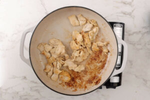 Cooking chicken on the stovetop.