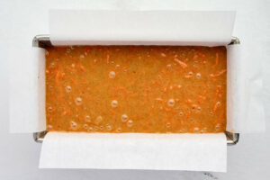 Carrot cake batter in a loaf pan.