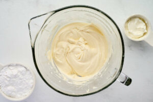 Adding extra sour cream to the frosting.