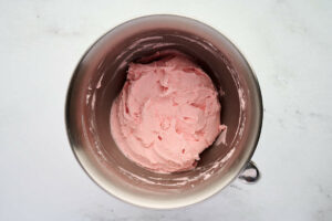 Maraschino cherry buttercream in a mixing bowl.