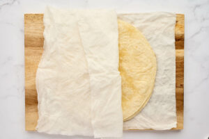 WrappingTortillas in a damp towel to warm them in the microwave.