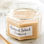 A jar filled with homemade thousand island dressing.