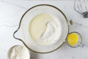 Adding the flour mixture to the whipped egg mixture.
