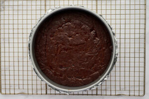 Cooling the dark chocolate torte on a rack.
