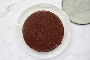 Removing the dark chocolate torte from the pan.