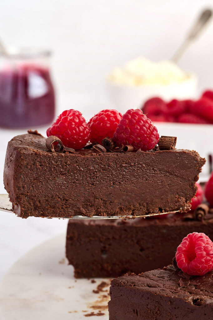 A spatula serving a slice of a chocolate torte.