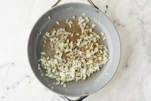 Cooking onions in the skillet.