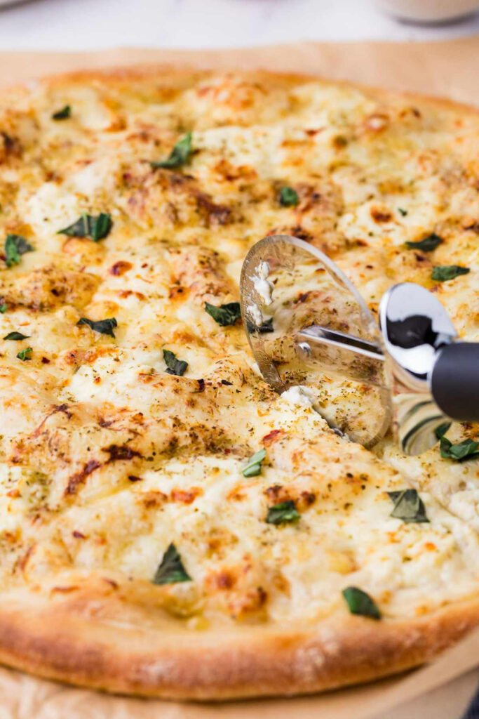A cheese pizza made with homemade pizza dough.