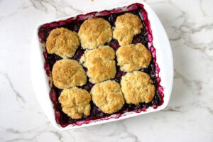 Homemade blueberry cobbler with biscuit topping baked until golden brown.