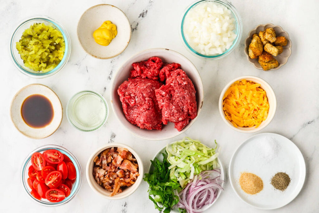 Cheeseburger salad with seasoned ground beef, cheddar cheese, and crisp romaine lettuce.