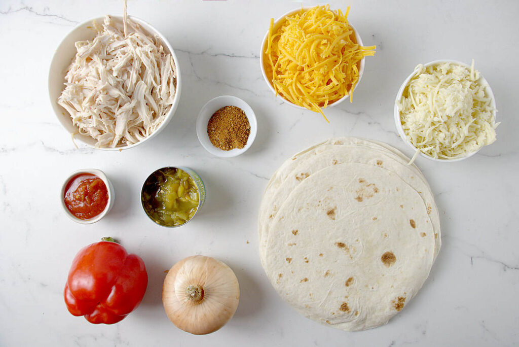 Ingredients used to make chicken and cheese quesadillas.