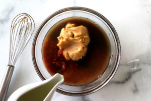 Combining miso with lime juice and soy sauce.