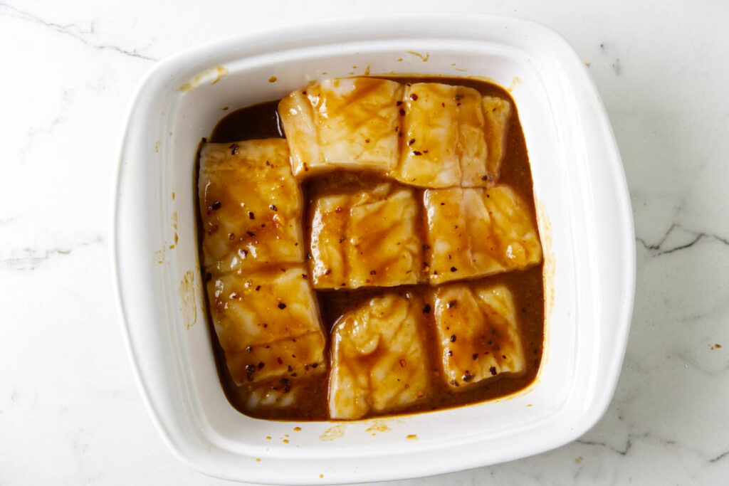 Marinating the halibut in a miso mixture.