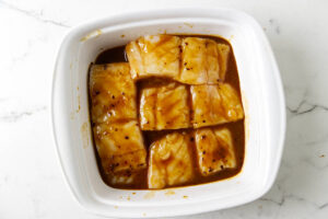 Marinating the halibut in a miso mixture.