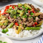Ground beef and broccoli stir fry served over steamed white rice.