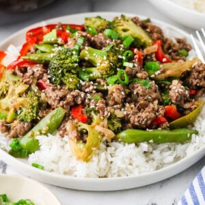 Ground beef and broccoli stir fry served over steamed white rice.