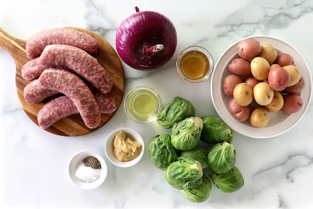 Ingredients used to make a sausage and vegetable dinner.