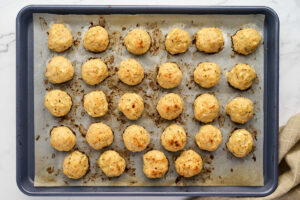Baked chicken meatballs with golden tops and Greek seasoning.