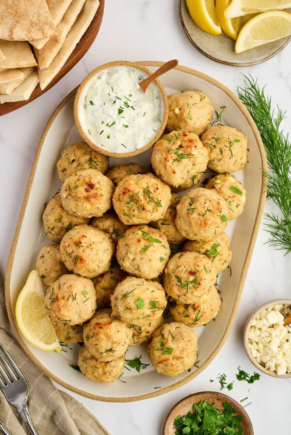 Chicken feta meatballs served with tzatziki sauce.