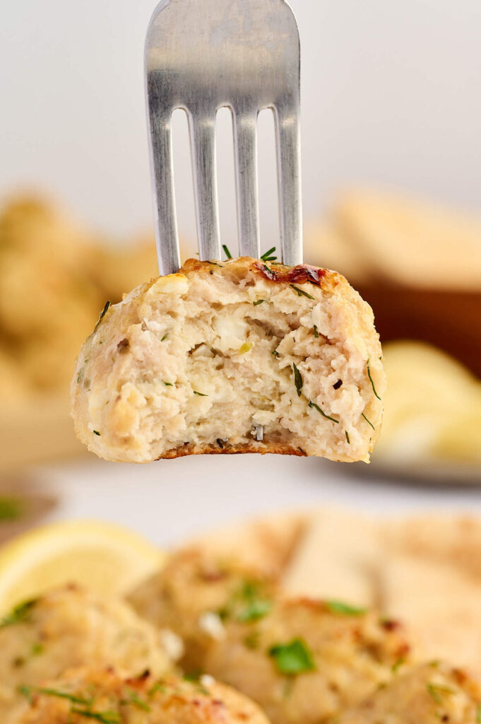 Juicy baked chicken meatballs with Greek herbs and lemon zest.