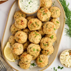 Greek chicken meatballs with feta, herbs, and a creamy dipping sauce.