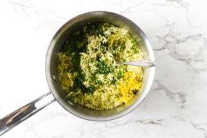 Fresh dill and lemon zest stirred into cooked Greek lemon rice.